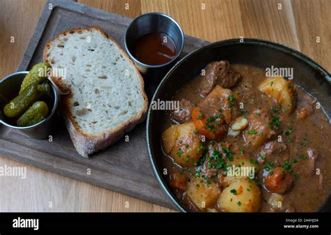 Liverpool Scouse stew with bread and pickles Stock Photo - Alamy