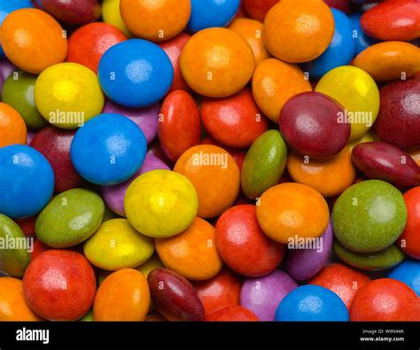 Small Pile of Round Chocolate Candies Background Stock Photo - Alamy