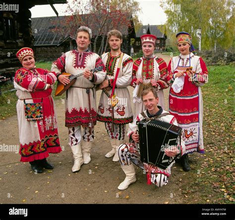 A russian folk music group in traditional clothing in a small remote village along the Volga ...