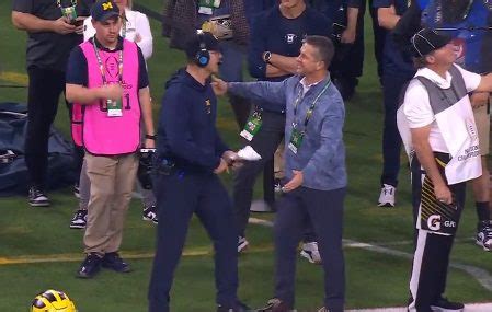 “WHO’S GOT IT BETTER THAN US? – NOBODY”: Harbaugh Brothers Hug on Field ...