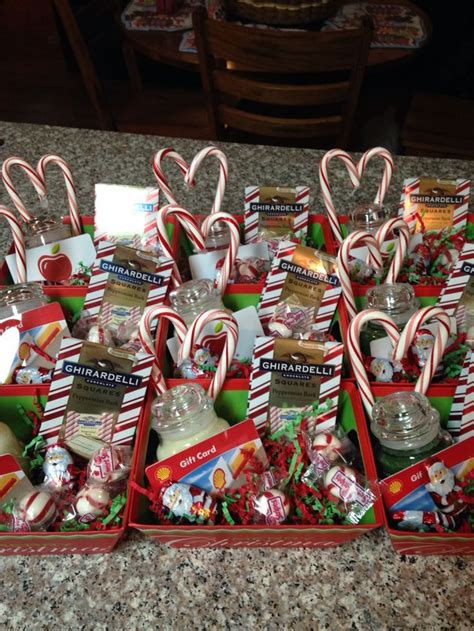 Christmas baskets for staff. Small Yankee candles with a gift card hot ...