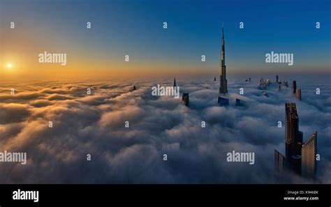 View of the Burj Khalifa and other skyscrapers above the clouds in ...