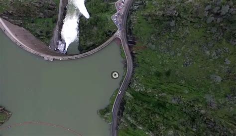 Drone Flies Over Lake, Captures Footage Of Strange Hole In Water On Its Private Cloud - NewsD