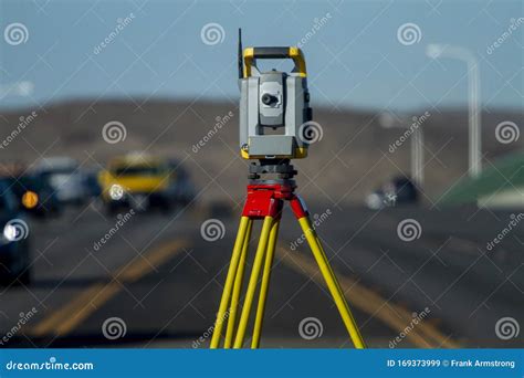 Land Survey Equipment Set Up on Road with Road Becoming a Hill Stock Image - Image of ...