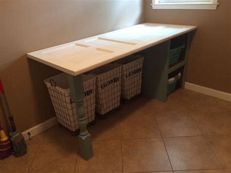 Laundry room folding table that my sweet husband made me using an old door from my great ...