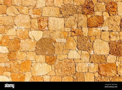 Background of ancient stone wall. Texture of old brick Stock Photo - Alamy