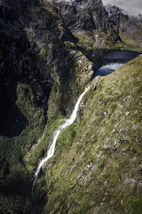 Sutherland Falls flowing from Lake Quill, high up in Fiordland [OC] [3456x5184] : r/EarthPorn