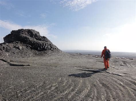 An Geologist inspects a portion of a spatter cone at Pu‘u ‘Ō‘ō. | U.S. Geological Survey