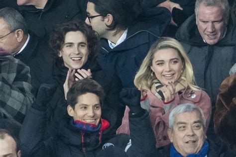 FLORENCE PUGH and Timothee Chalamet at PSG Match at Parc Des Princes in ...