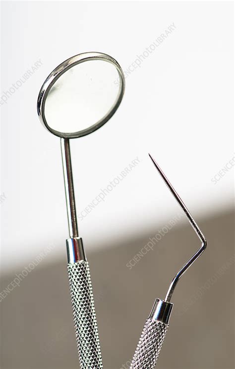 Dental Mirror & Probe - Stock Image - C039/0947 - Science Photo Library