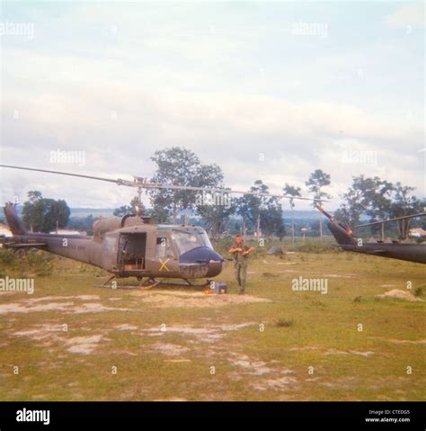 Huey helicopter parked at Landing Zone during Vietnam War B Model Stock ...