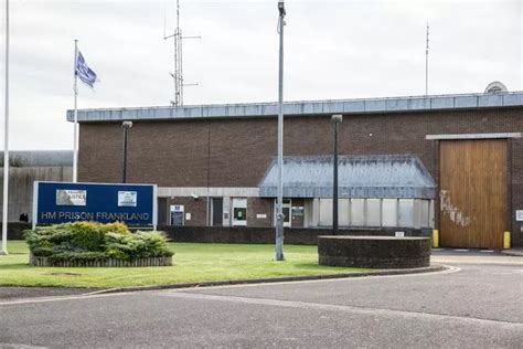 Inmate strips to his pants and climbs onto prison roof in bizarre stand ...