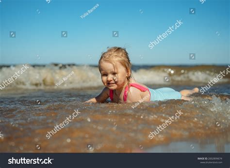 Little Girl Lying Sea Waves Image Stock Photo 2002899674 | Shutterstock