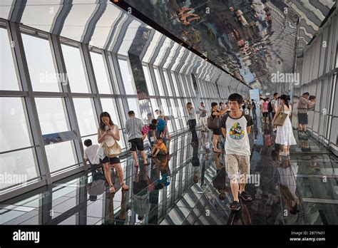 Visitors taking in views of Shanghai from the observation deck of the ...