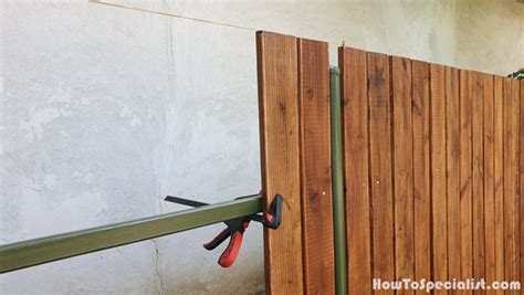 Installing-fence-boards | HowToSpecialist - How to Build, Step by Step DIY Plans