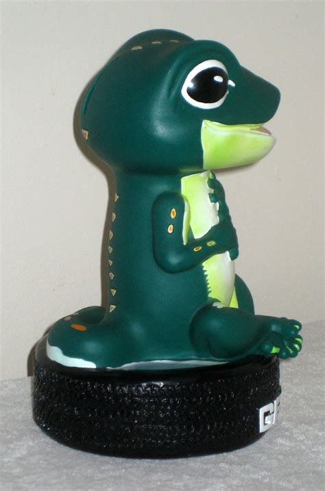 GEICO Lot Gecko Plastic Piggy Coin Bank Caveman Cave Man Bobblehead Tire Lizard Green Auto Insurance