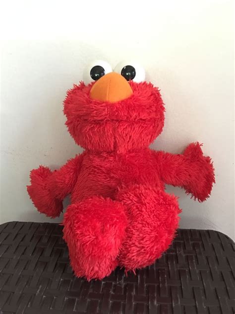 Elmo battery operated toy (talking,singing and laughing), Hobbies ...