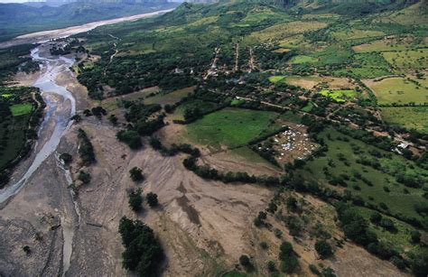 River flooding its banks, Hurricane Mitch, Honduras | Nigel Dickinson