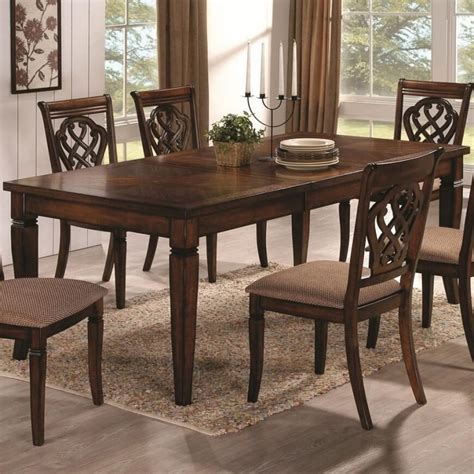 Elegant Carved Wood Table with Expandable Seating