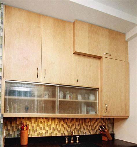 An example of vertical cabinets hung over horizontal sliding cabinets ...