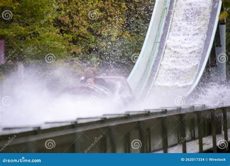 Extreme Water Flume Ride in the Amusement Park with Green Trees in the Background Stock Photo ...