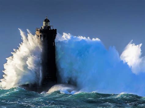 Lighthouse in Ocean Storm - Image Abyss