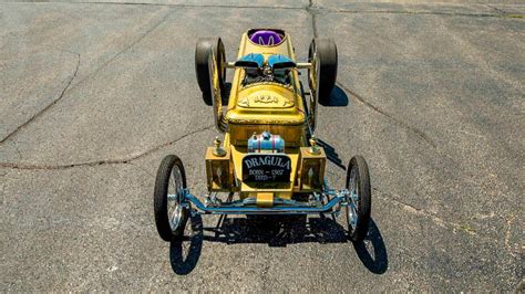 This coffin has been transformed into a four-wheeled V8 Dragula replica ...