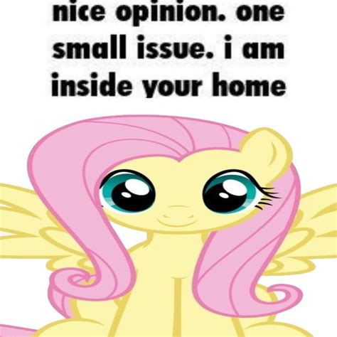 a little pony with pink hair sitting on top of it's stomach and the ...