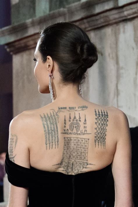 Angelina Jolie's tattoo artist breaks silence on mysterious new tattoo ...