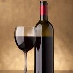 Bottle and glass of red wine — Stock Photo © Antartis #3862131