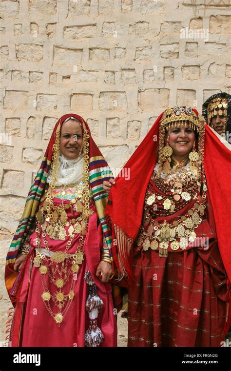 Tunisian women wearing traditional dresses golden jewelry and ornaments ...