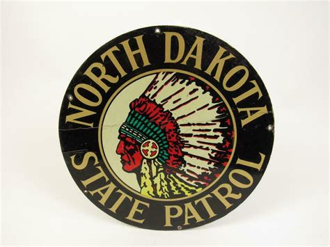 Vintage North Dakota State Highway Patrol die-cut tin squad car sign with Sioux Chieftain logo ...