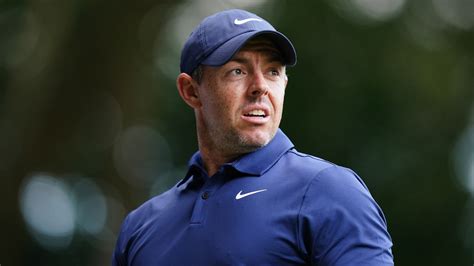 Rory McIlroy fights through tough conditions to keep cut hopes alive as chaos ensues on final ...