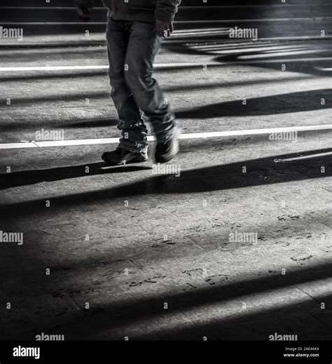 Man walking alone in dark hi-res stock photography and images - Alamy