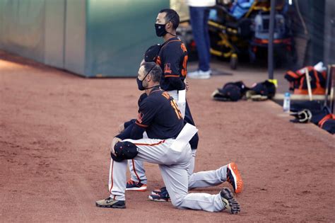 Giants manager Gabe Kapler kneels with players for national anthem ...