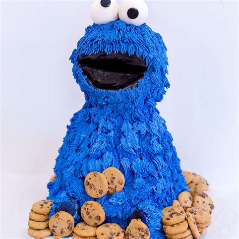 a cookie monster cake with cookies on the bottom and one cookie in the middle that is made out ...