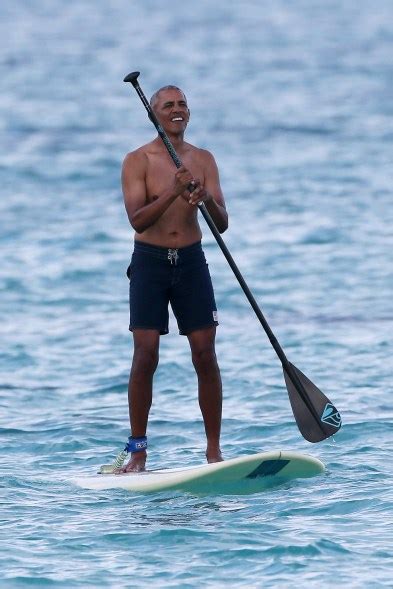 Barack Obama spotted paddle boarding in Hawaii