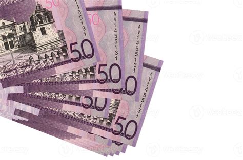 50 Dominican pesos bills lies in small bunch or pack isolated on white ...