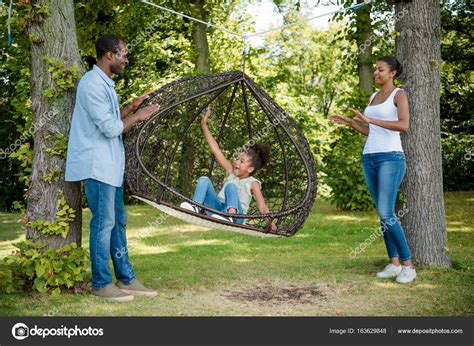 African american family on swing — Stock Photo © AlexNazaruk #163629848