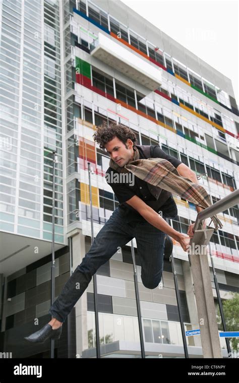 Man jumping over fence in city hi-res stock photography and images - Alamy