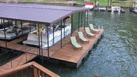 a boat dock with lounge chairs on it