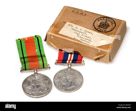 British World War 2 War Medal (left) and Defence Medal with original packaging used for delivery ...