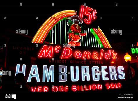 original multicoloured illuminated neon sign of McDonalds hamburgers Stock Photo - Alamy