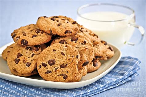 Chocolate chip cookies and milk Photograph by Elena Elisseeva