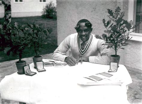 Three boxes containing gold medals sit at the base of the pots of three ...