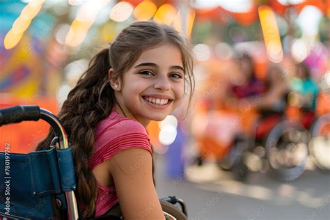 A girl in a wheelchair having a fun day out with friends at an ...