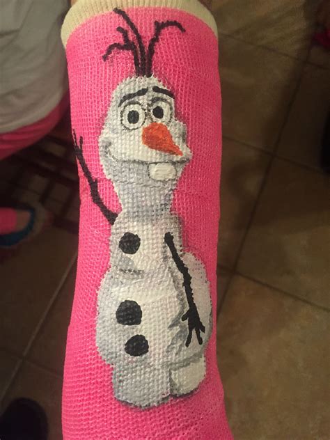 someone is wearing a pink sock with a frozen snowman on the front and ...