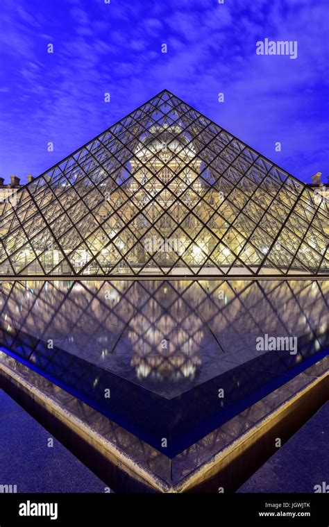 Louvre Museum at night in Paris, France Stock Photo - Alamy