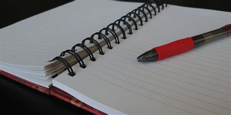 Open Notebook With Red Pen Free Stock Photo - Public Domain Pictures