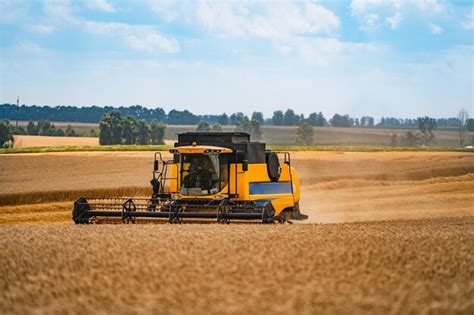 Premium Photo | Combine harvesting wheat Grain harvesting equipment in the field Harvest time